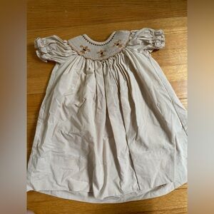 Banbury Cross 24M New Orleans Saints dress with fleur de lis smocking